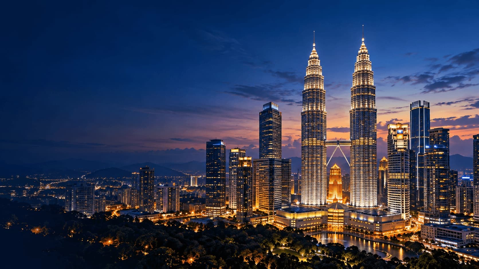 Kuala Lumpur skyline at dusk with the illuminated Petronas Twin Towers